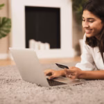 woman-sitting-floor-holding-credit-card_23-2148304822